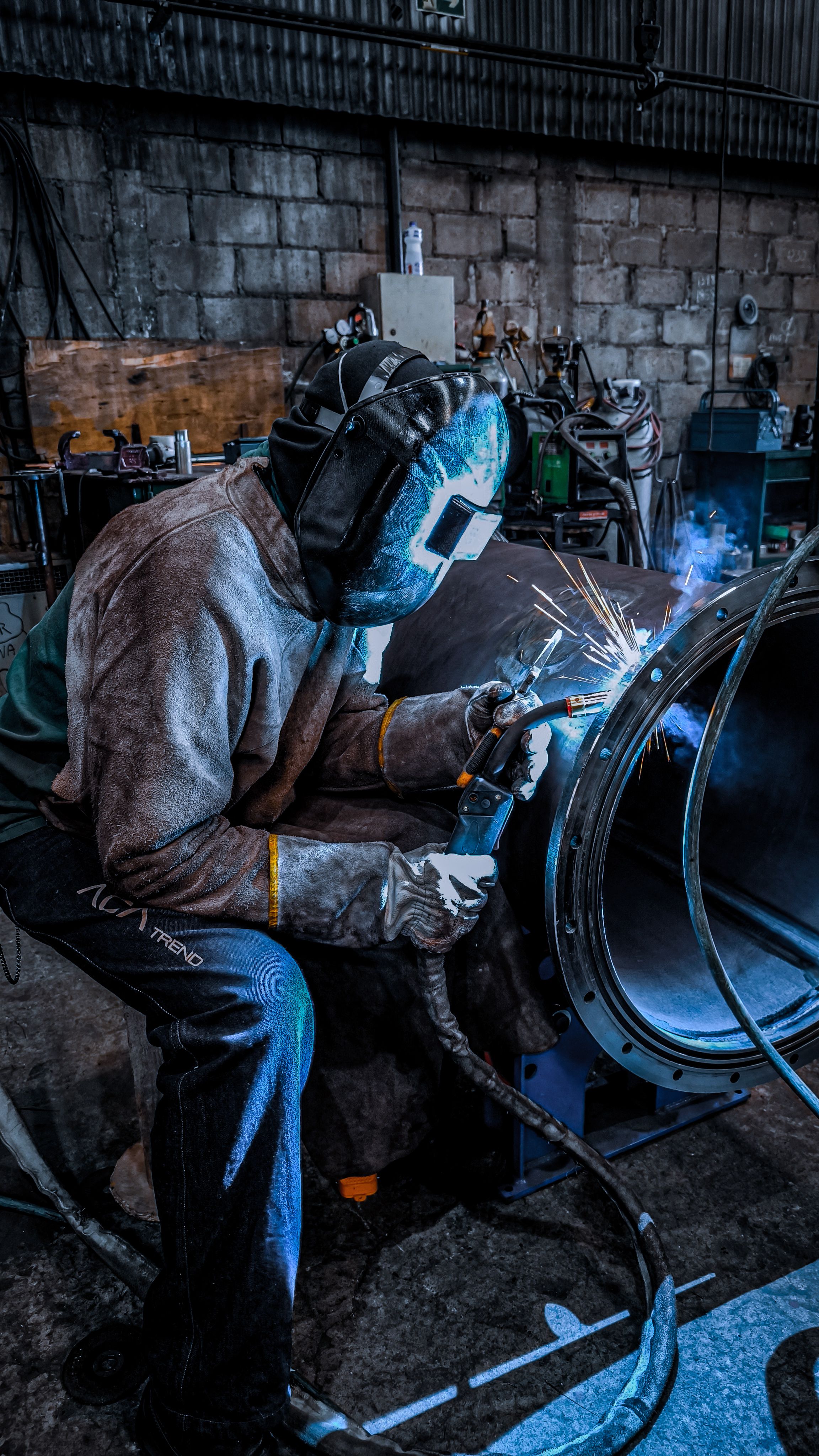 Metal fabrication work with sparks and precision tools